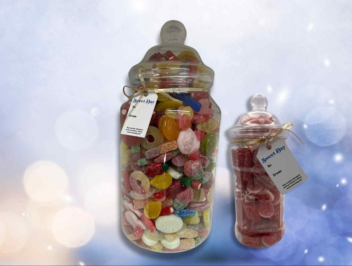 Two glass jars filled with colorful candies on a blurred light background