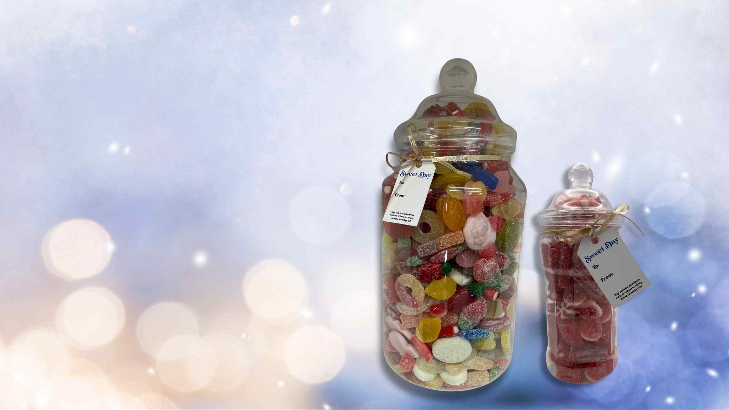 Two glass jars filled with colorful candies on a blurred light background
